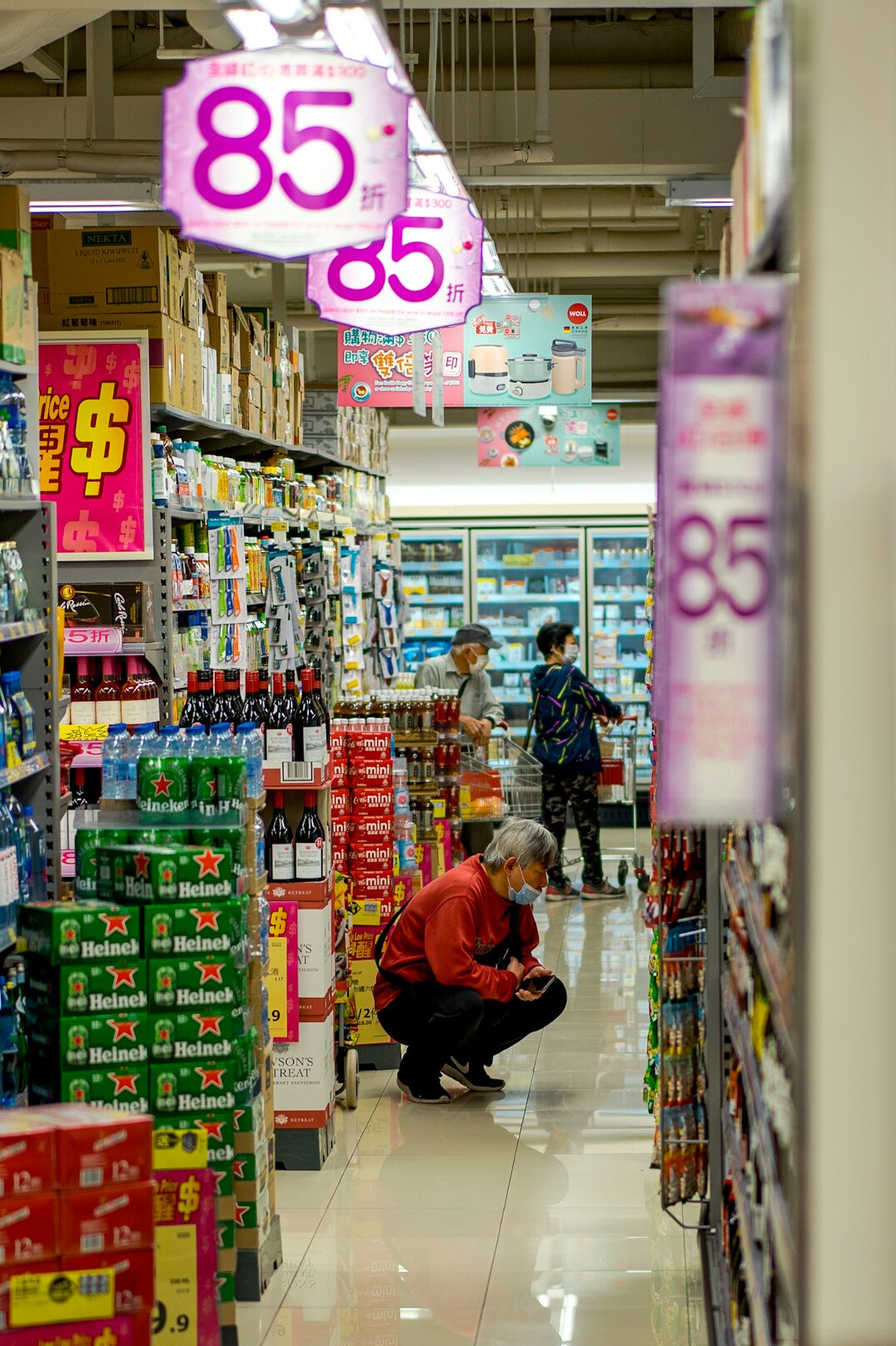 happy shoppers in supermarket